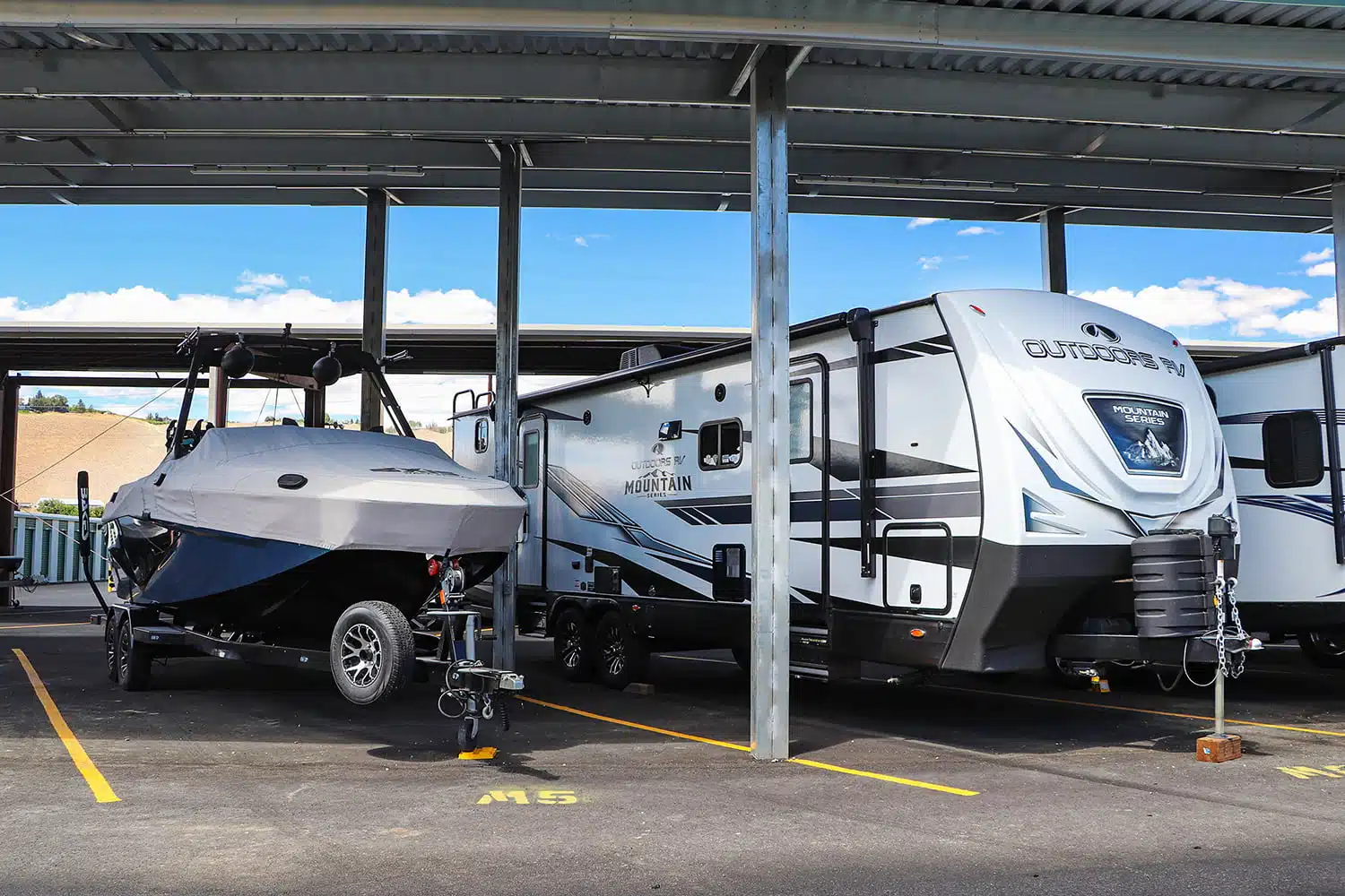 Boat and RV in parking spots