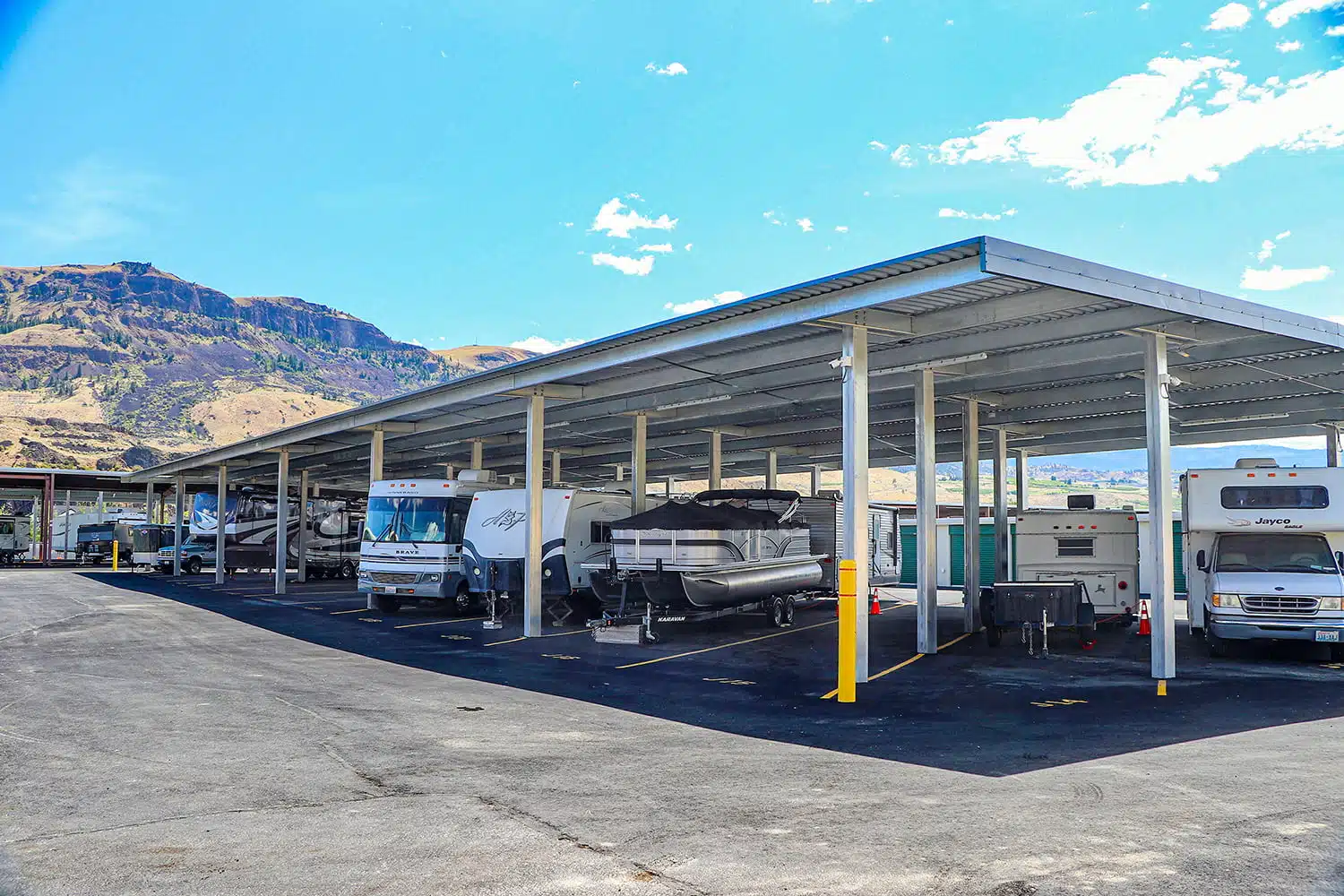 Covered parking spaces with mountain background