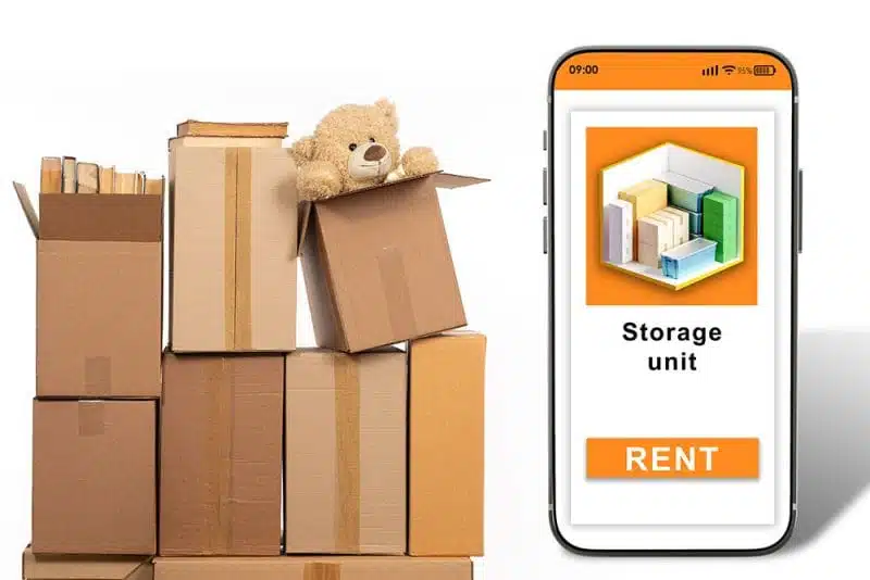 Stack of boxes on the right and a mobile phone on the right showing a visual of a 3D Storage unit with a rent button