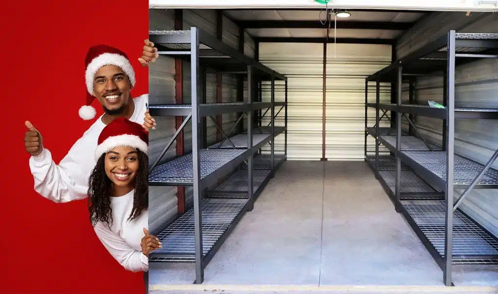 A couple wearing Santa hats presenting the premium storage unit at EZ Access Storage